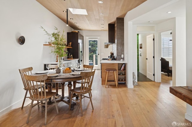 1515 Van Dyke Ave, San Francisco, CA 94124 - dining space with a skylight, light wood-style floors, recessed lighting, and wooden ceiling