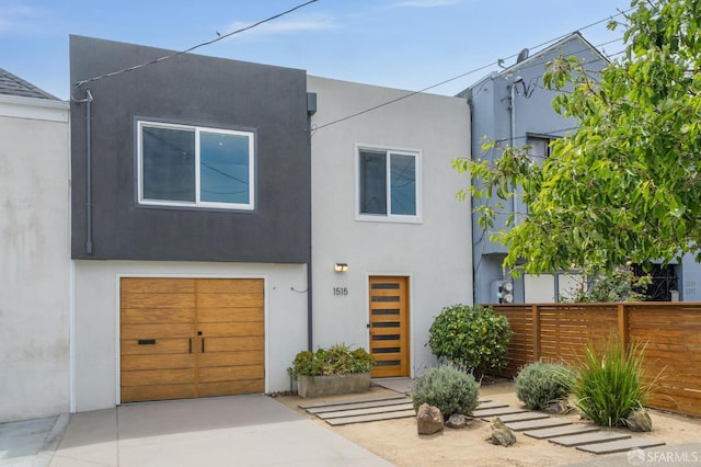 1515 Van Dyke Ave, San Francisco, CA 94124 - view of front facade featuring a garage, concrete driveway, and stucco siding