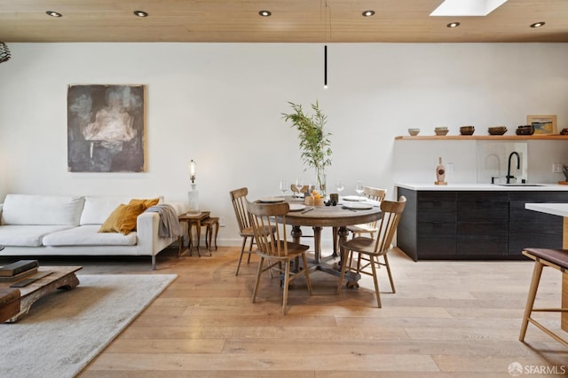 1515 Van Dyke Ave, San Francisco, CA 94124 - dining room with light wood-style floors, recessed lighting, and a skylight