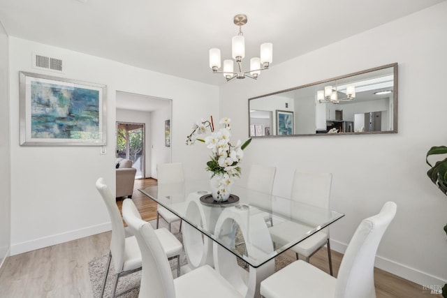 7 Hearthstone Ct, San Rafael, CA 94903 - dining room featuring a chandelier, wood finished floors, and baseboards