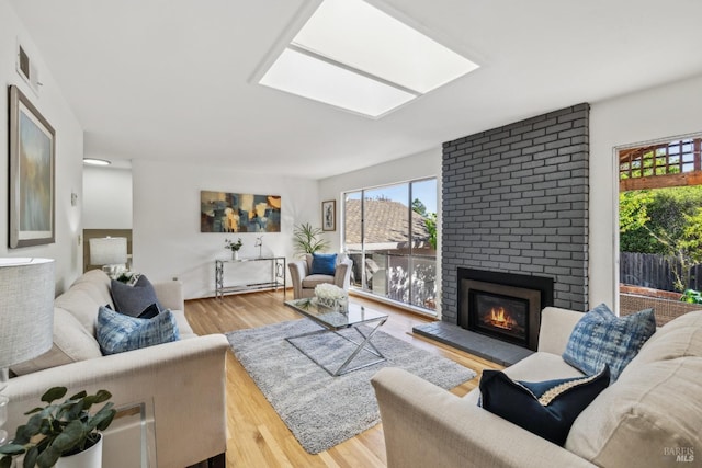 7 Hearthstone Ct, San Rafael, CA 94903 - living room featuring a fireplace, wood finished floors, and a skylight