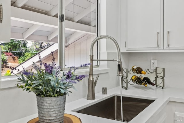 7 Hearthstone Ct, San Rafael, CA 94903 - kitchen view of a sink, light countertops, white cabinets, and backsplash