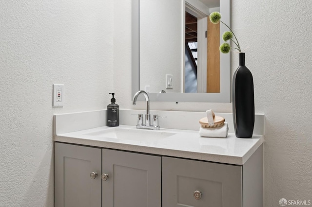 175 Bluxome St Unit 202, San Francisco, CA 94107 - bathroom featuring a textured wall and vanity