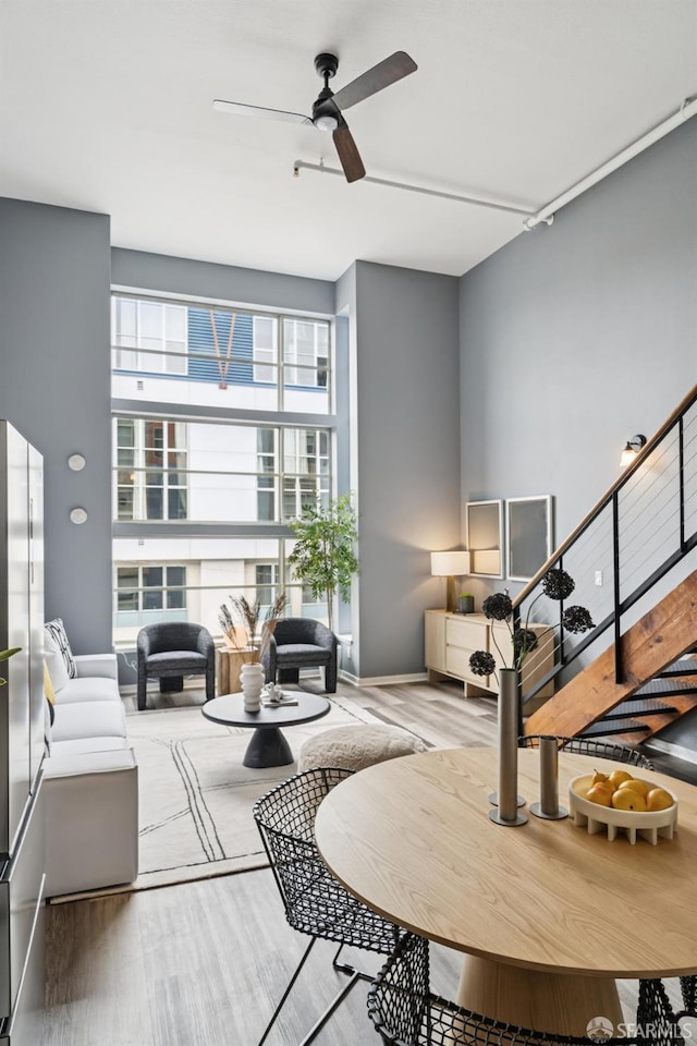 175 Bluxome St Unit 202, San Francisco, CA 94107 - living room with ceiling fan, wood finished floors, and stairs