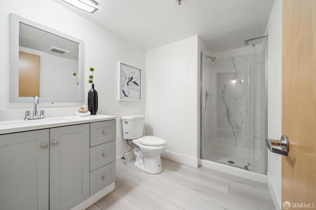 175 Bluxome St Unit 202, San Francisco, CA 94107 - full bathroom featuring a marble finish shower, vanity, and wood finished floors