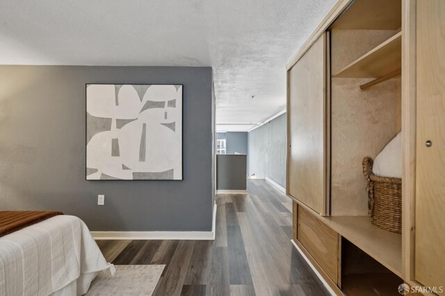 175 Bluxome St Unit 202, San Francisco, CA 94107 - bedroom featuring dark wood-type flooring and a closet