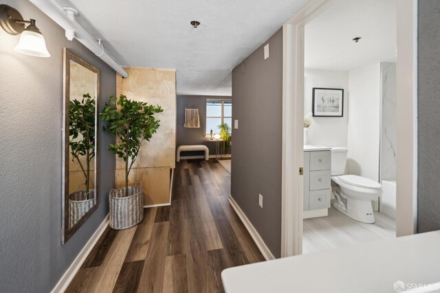 175 Bluxome St Unit 202, San Francisco, CA 94107 - hallway with wood finished floors