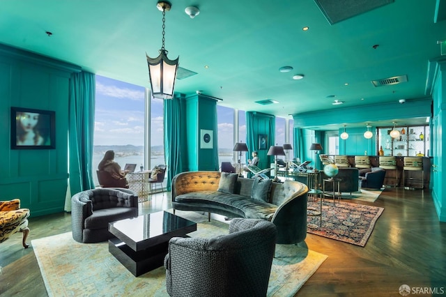 living area with a water view and visible vents
