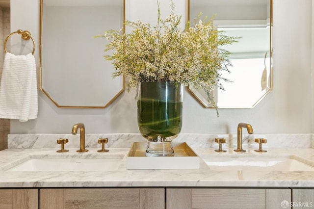 bathroom featuring double vanity and a sink