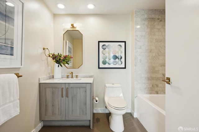bathroom featuring vanity, toilet, baseboards, recessed lighting, and tile patterned floors