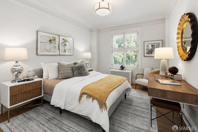 1998 Vallejo St Unit 2, San Francisco, CA 94123 - bedroom with wood finished floors, radiator, and crown molding