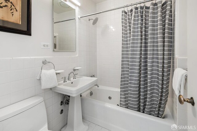 1998 Vallejo St Unit 2, San Francisco, CA 94123 - bathroom with shower / bath combo with shower curtain and tile walls