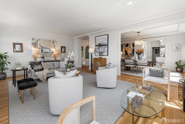 1998 Vallejo St Unit 2, San Francisco, CA 94123 - living area with a chandelier, ornamental molding, and wood finished floors