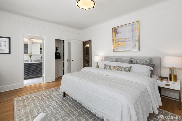 1998 Vallejo St Unit 2, San Francisco, CA 94123 - bedroom featuring wood finished floors and ensuite bath
