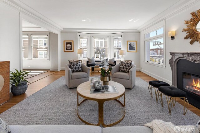 1998 Vallejo St Unit 2, San Francisco, CA 94123 - living room featuring a premium fireplace, ornamental molding, and wood finished floors