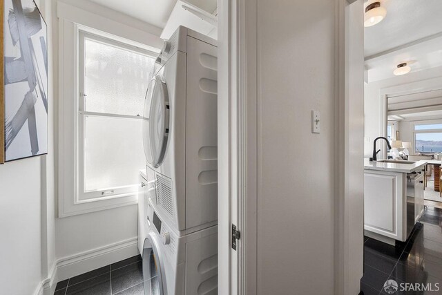 1998 Vallejo St Unit 2, San Francisco, CA 94123 - bathroom featuring stacked washing machine and dryer and a sink
