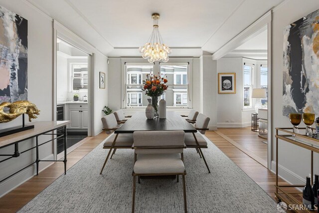 1998 Vallejo St Unit 2, San Francisco, CA 94123 - dining space featuring a chandelier and light wood finished floors