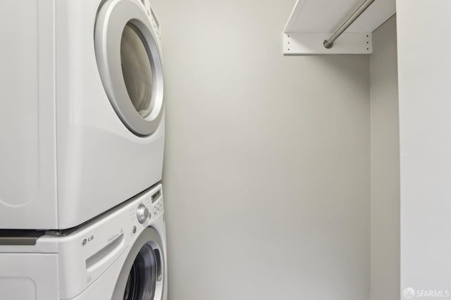 laundry area featuring stacked washer and clothes dryer