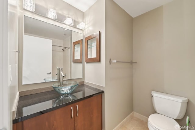 bathroom with tile patterned floors, vanity, and toilet