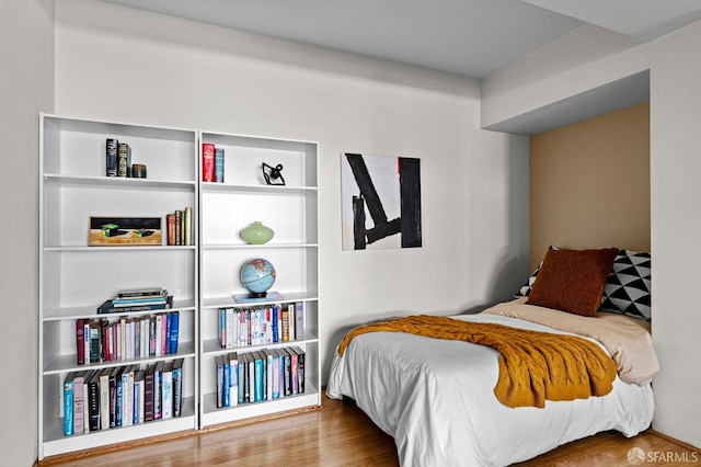 bedroom featuring hardwood / wood-style flooring