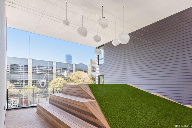 view of yard with a balcony