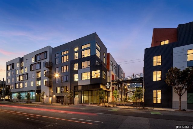 view of outdoor building at dusk