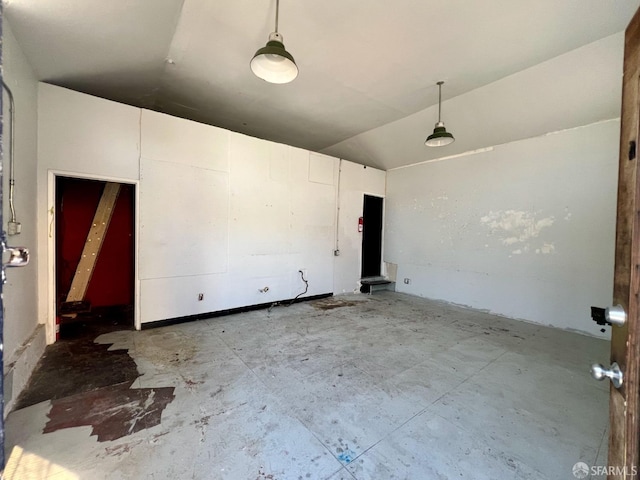 spare room with lofted ceiling