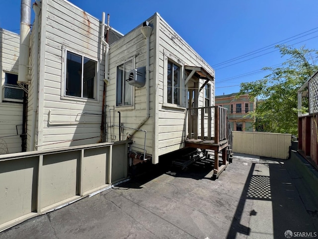 view of property exterior with fence