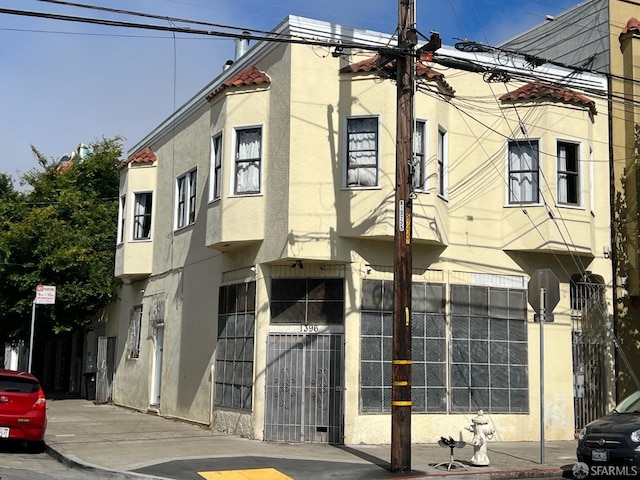 view of building exterior featuring fence