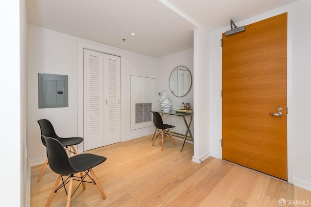 entrance foyer with light wood-type flooring and electric panel