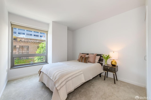 bedroom with light carpet