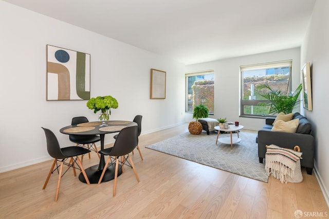 dining space featuring light hardwood / wood-style floors