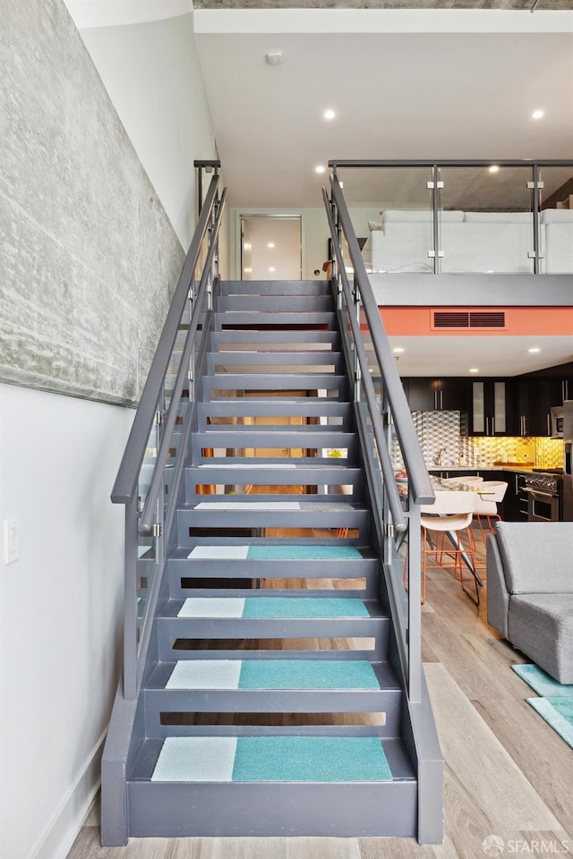 stairway with wood-type flooring