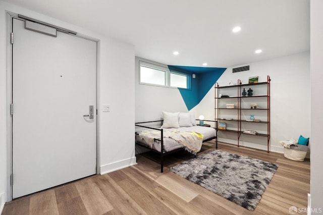 living area with light hardwood / wood-style floors