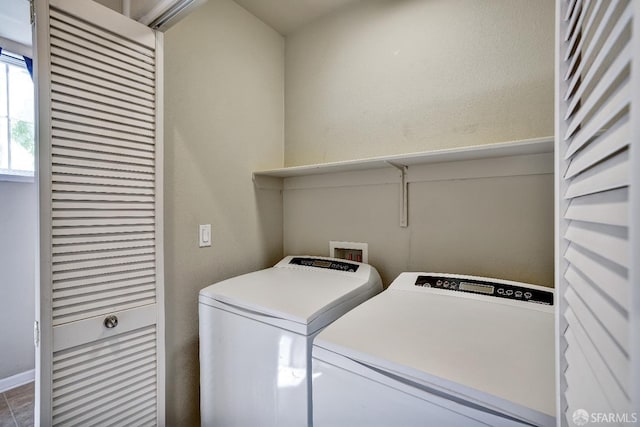 laundry room featuring separate washer and dryer