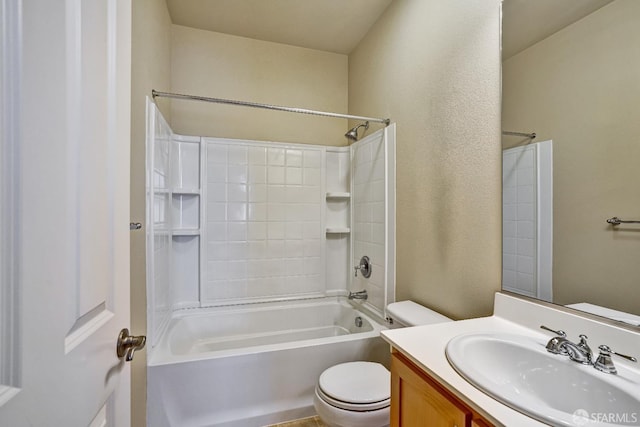 full bathroom featuring toilet, vanity, a textured wall, and shower / bath combination