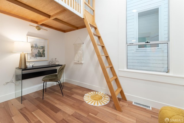 interior space featuring light hardwood / wood-style floors and wood ceiling