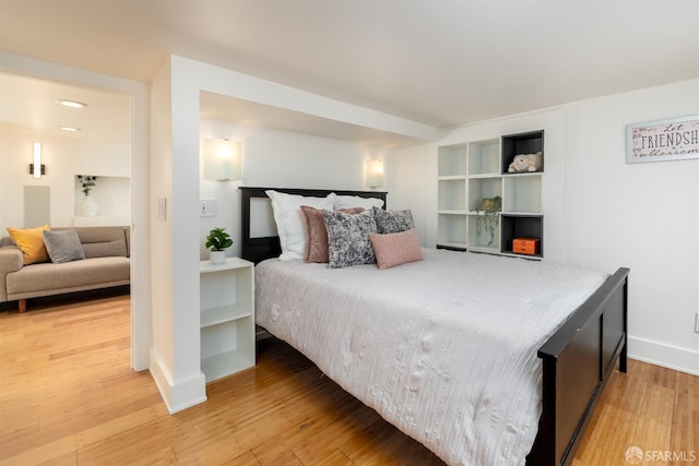 bedroom with hardwood / wood-style floors