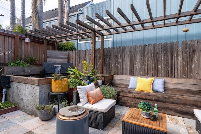 view of patio with an outdoor fire pit and a pergola