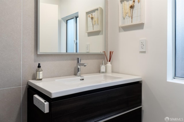 bathroom featuring a wealth of natural light and vanity