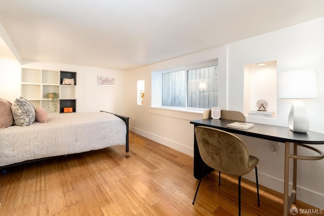 bedroom with light hardwood / wood-style floors