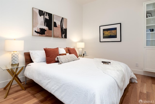 bedroom featuring hardwood / wood-style floors