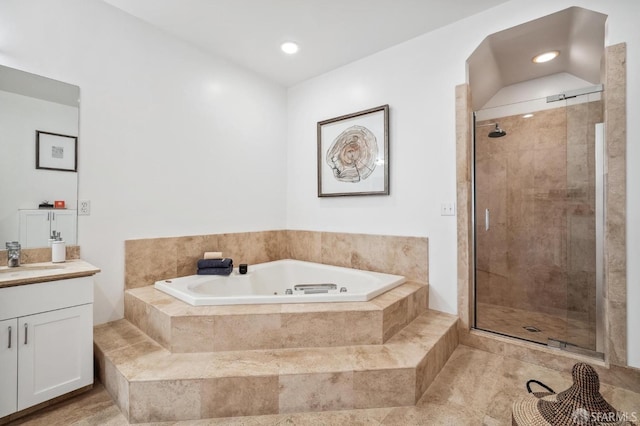 bathroom with vanity, tile patterned floors, and plus walk in shower