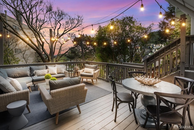 deck featuring outdoor dining space and an outdoor hangout area