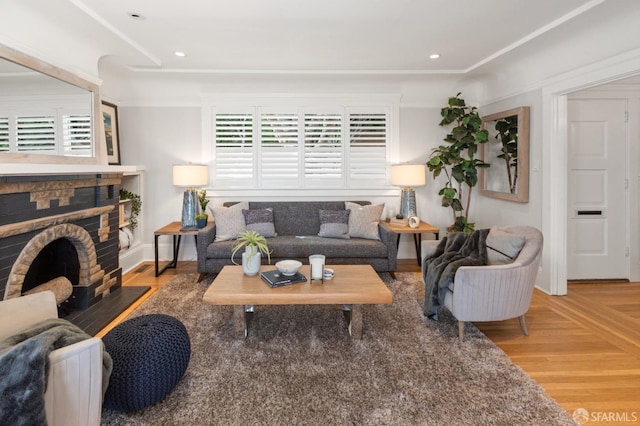 living area with baseboards, parquet flooring, a fireplace with flush hearth, and recessed lighting