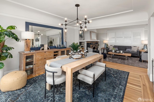 dining room with a notable chandelier and wood finished floors