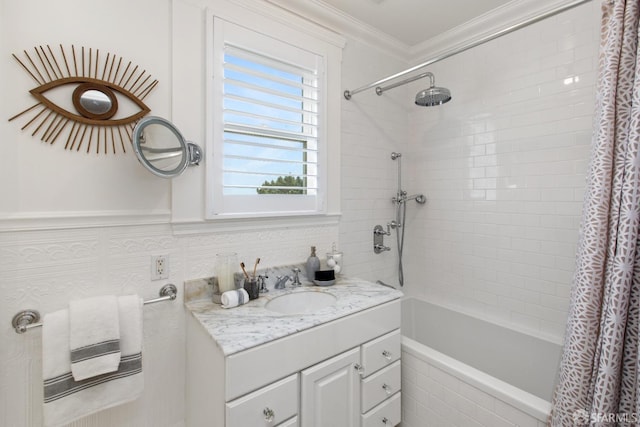 bathroom featuring ornamental molding, tiled shower / bath combo, and vanity