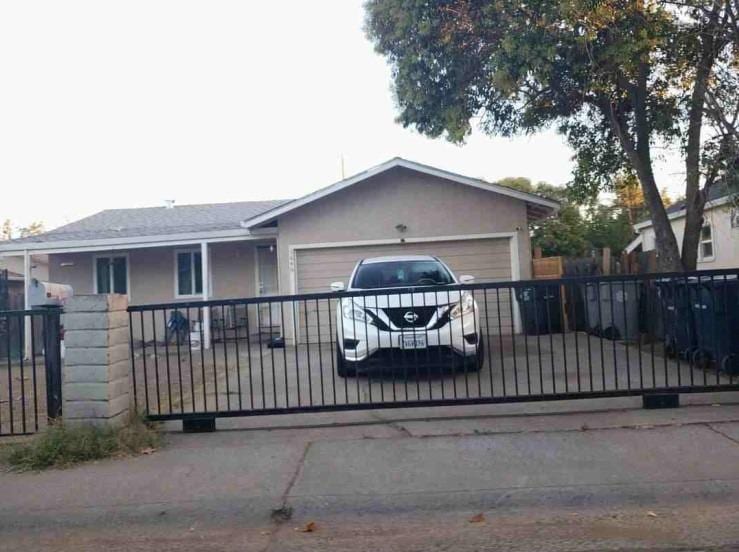 view of gate featuring a garage