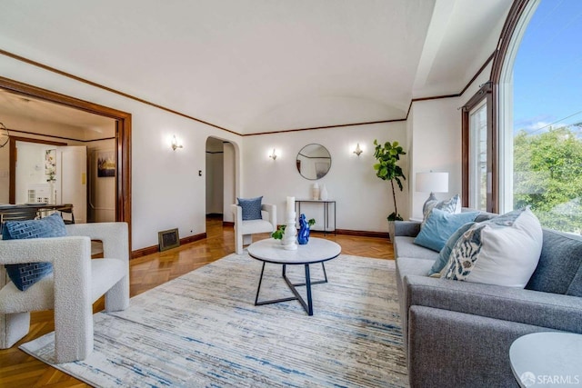 living room with arched walkways, visible vents, crown molding, and baseboards