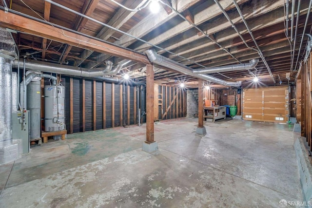 unfinished basement featuring heating unit and secured water heater